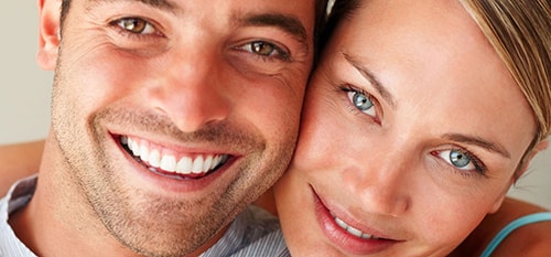 Couple smiling after Invisalign treatment in Scottsdale, AZ.