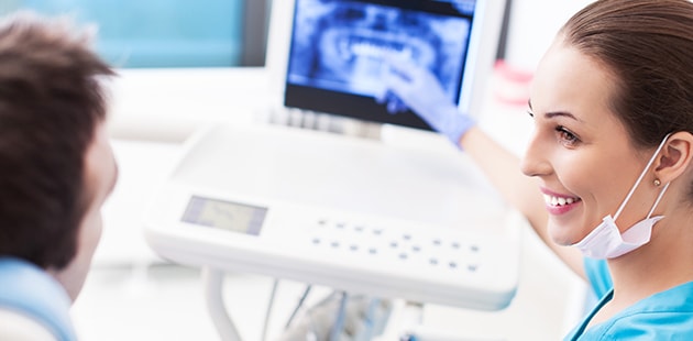 Patient reviewing his digital x-rays from Scottsdale Dentist Dr. Lewandowski