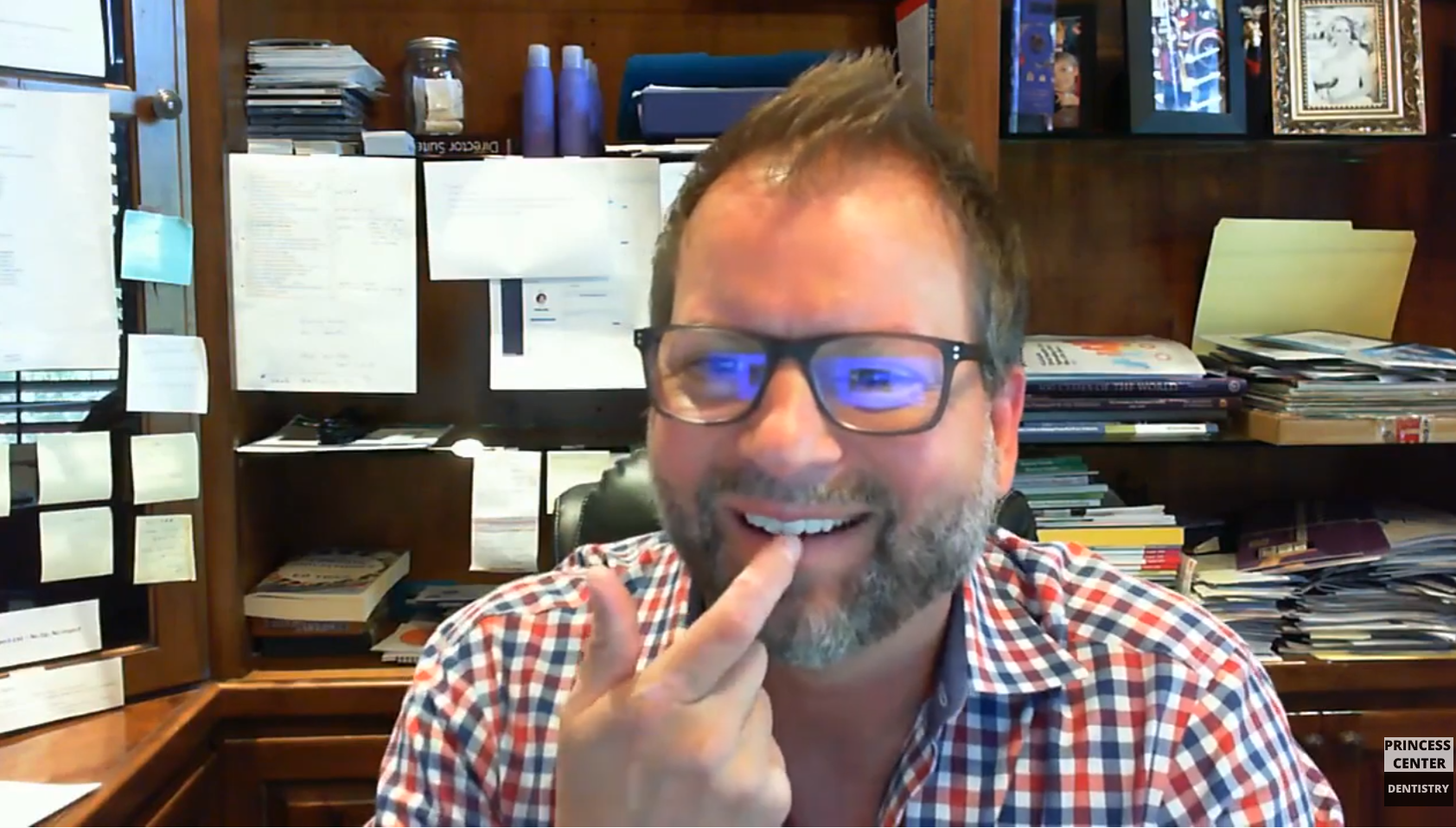 Dr. Lew pointing to a (pretend) gap in his front teeth