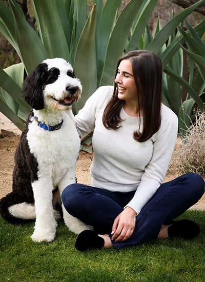 Dr. Andrews sits with Shilo, her pet dog.